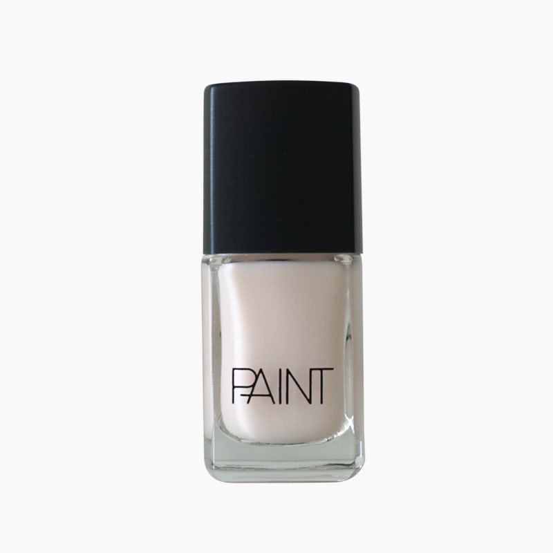 A bottle of Bronte summer nail polish by Paint Nail Lacquer against a white backdrop, this shade is a classic glossy white 