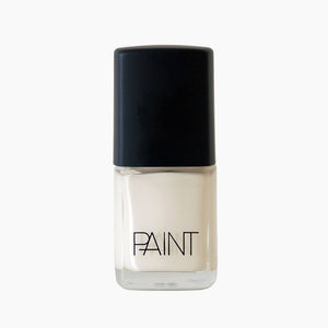 A bottle of Coconut Cream nail polish by Paint Nail Lacquer against a white backdrop, this shade is a creamy white colour 