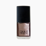 A bottle of Copper Blush nail polish by Paint Nail Lacquer against a white backdrop, this shade is a metallic dark pink with gold undertones.