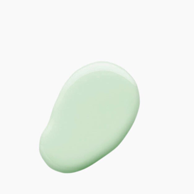 A sample of mint sorbet Nail Polish pouring onto a bench, this shade is a light leafy pastel green colour