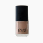 A bottle of paint naked nail polish by Paint Nail Lacquer against a white backdrop, this shade is a light nude brown colour