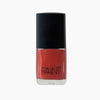 A bottle of Tuscan Summer nail polish by Paint Nail Lacquer against a white backdrop, this shade is a burnt orange red colour