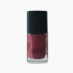 A bottle of Velvet Berry nail polish by Paint Nail Lacquer against a white backdrop, this shade is a dark magenta pink colour